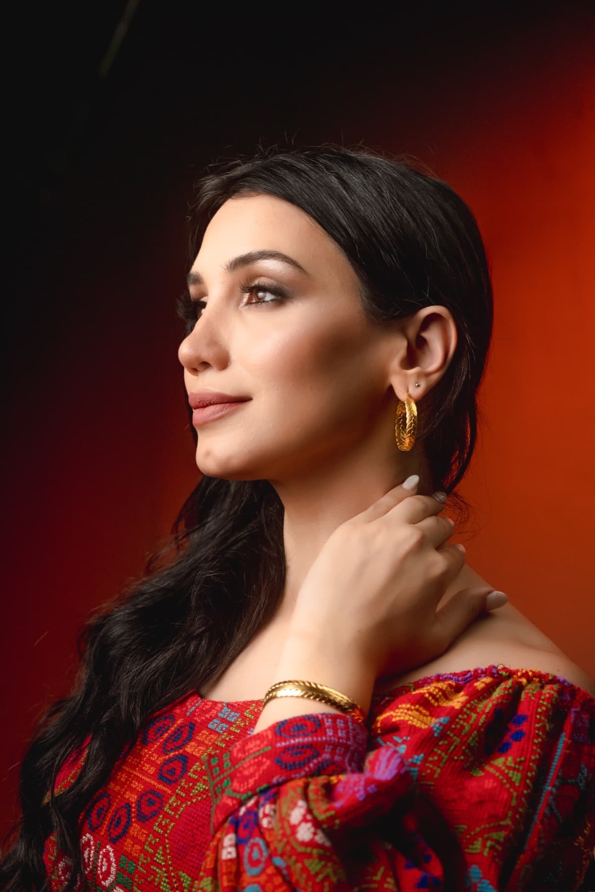 Portrait wearing embroidered red garment for Jadra