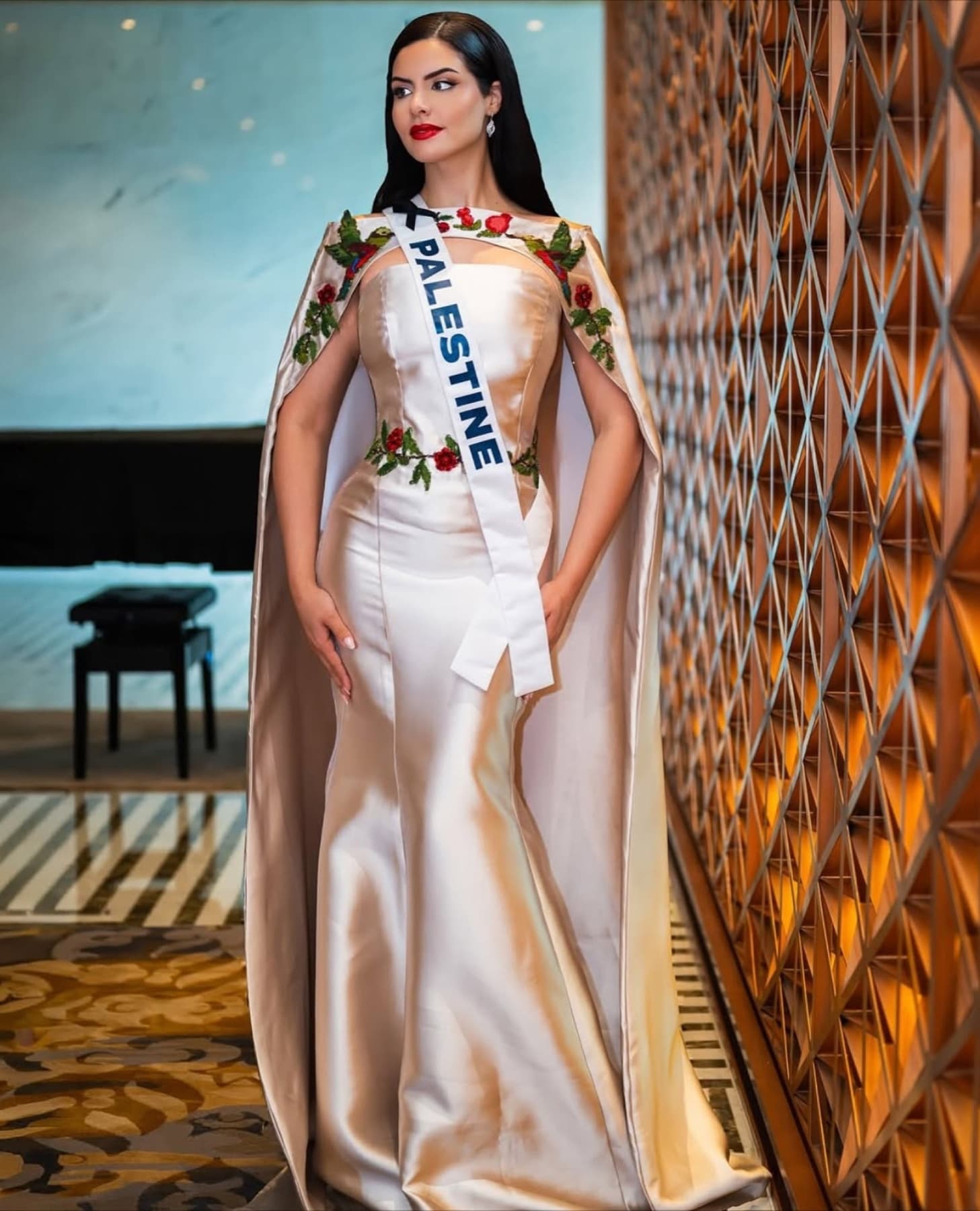 Nadeen Ayoub standing in the embroidered Miss Palestine look