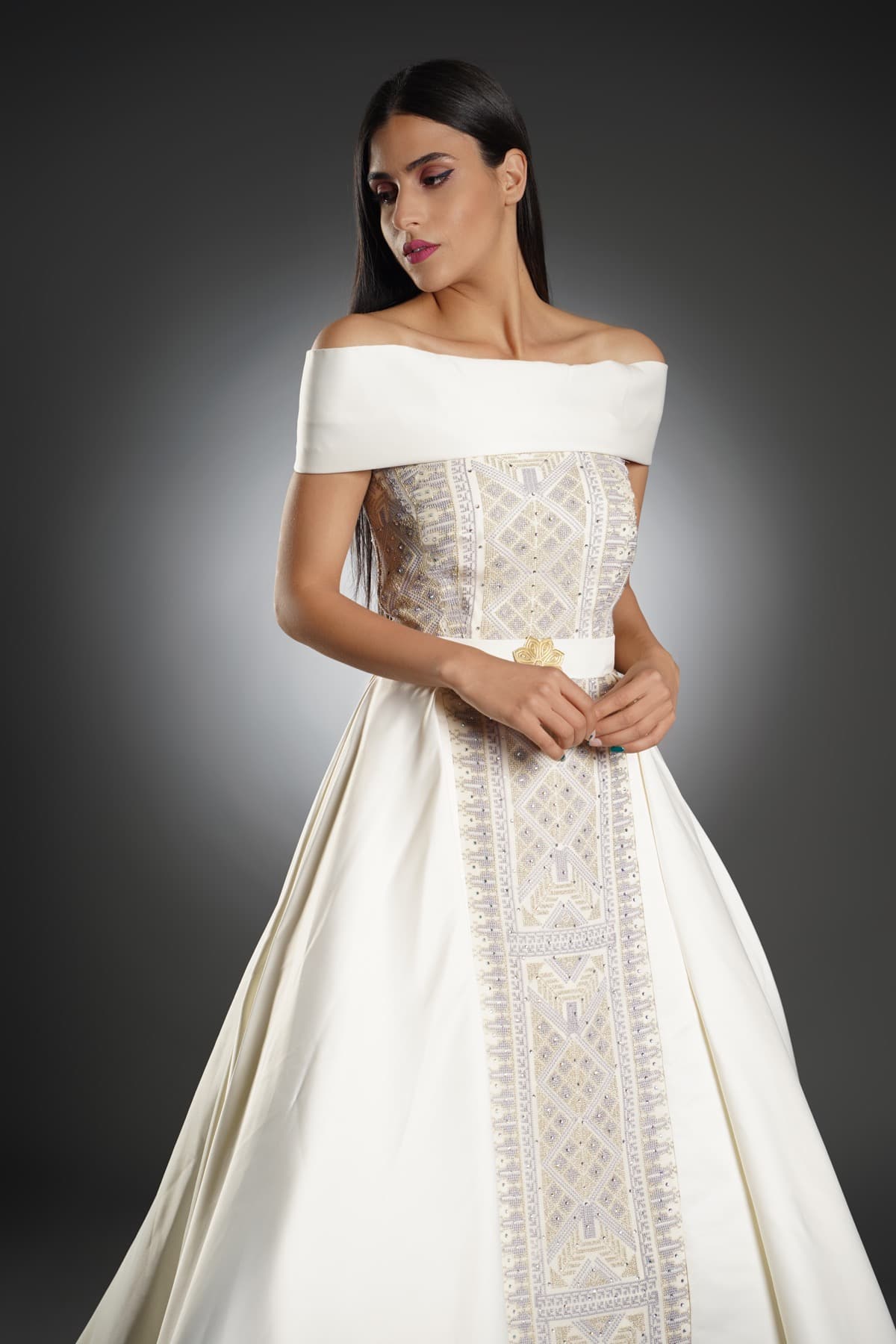 Off-shoulder bridal gown with Palestinian embroidery