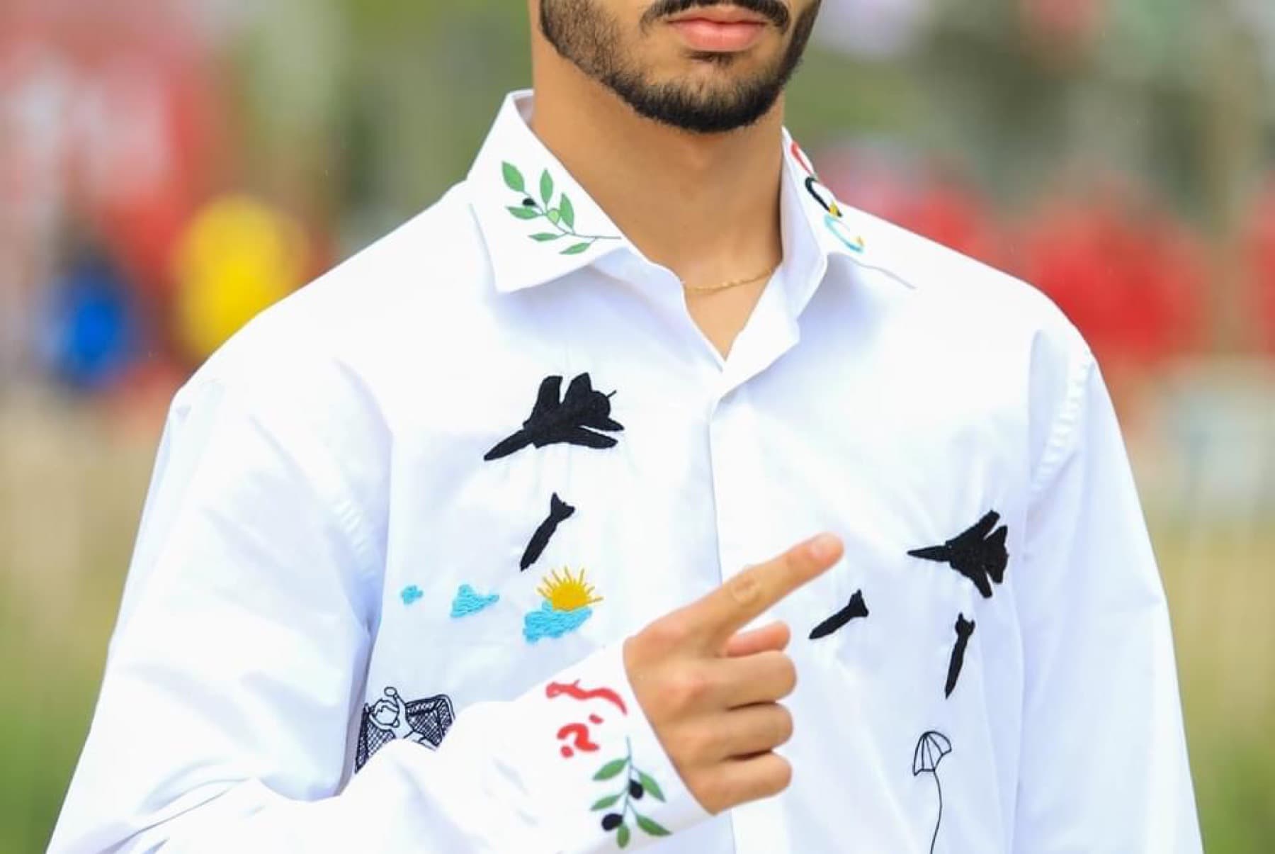 White shirt with embroidered Palestinian motifs