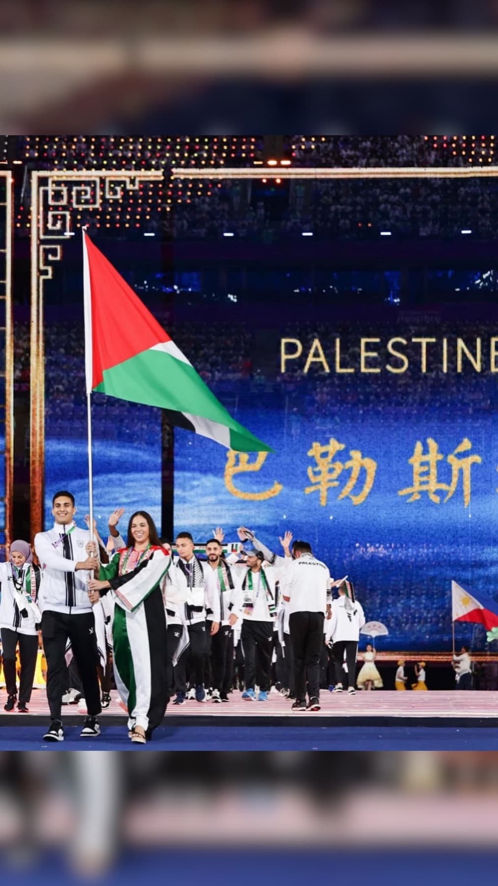 Palestinian delegation entering the Olympic ceremony stage
