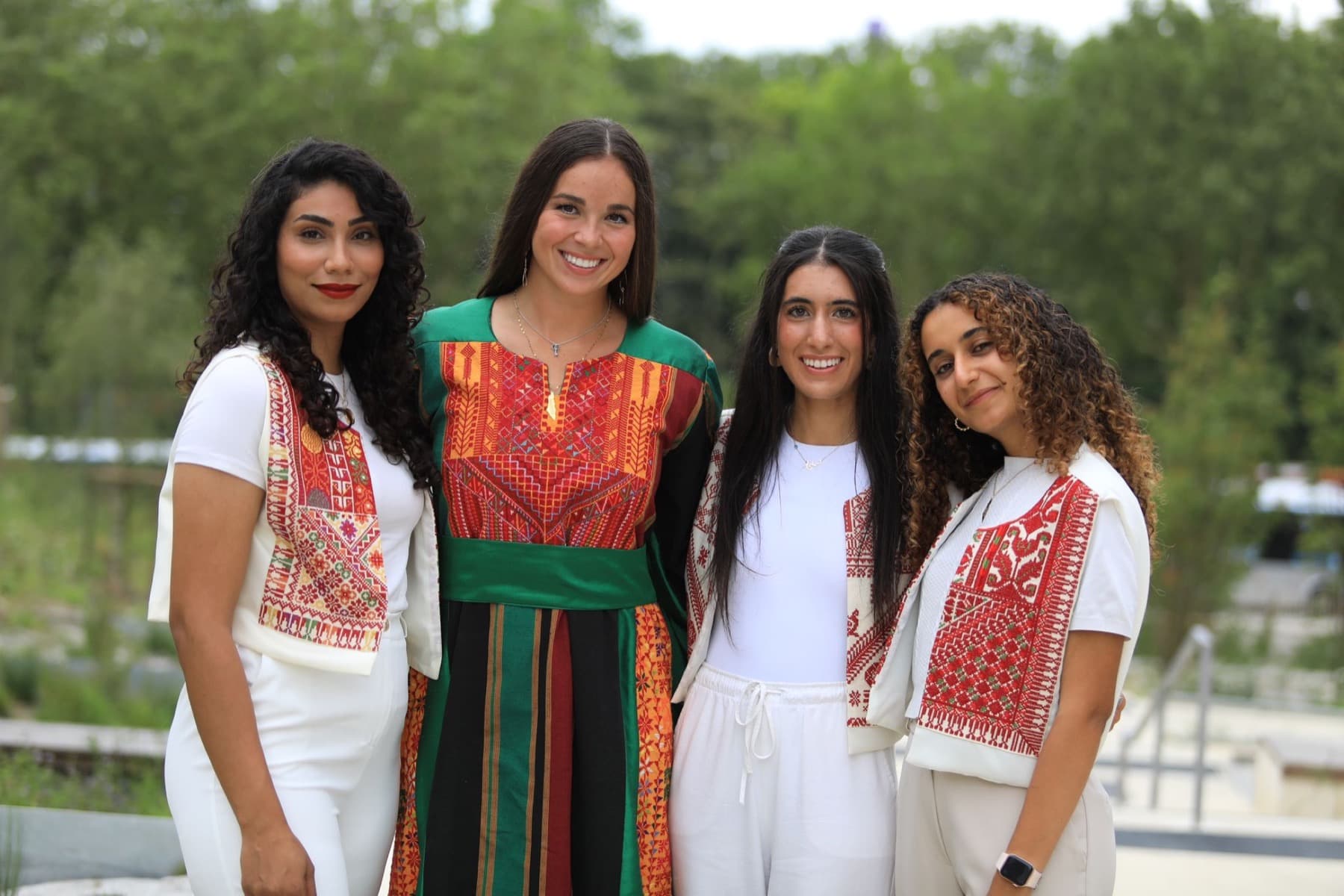 Women wearing embroidered ceremonial garments for Palestine