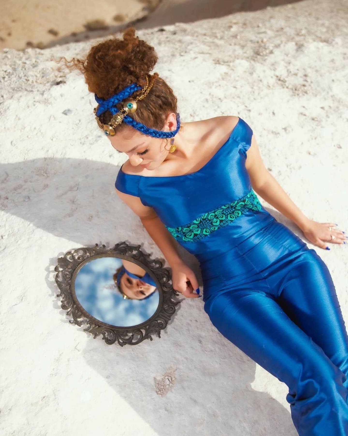 Cobalt motif garment with mirror reflecting sky