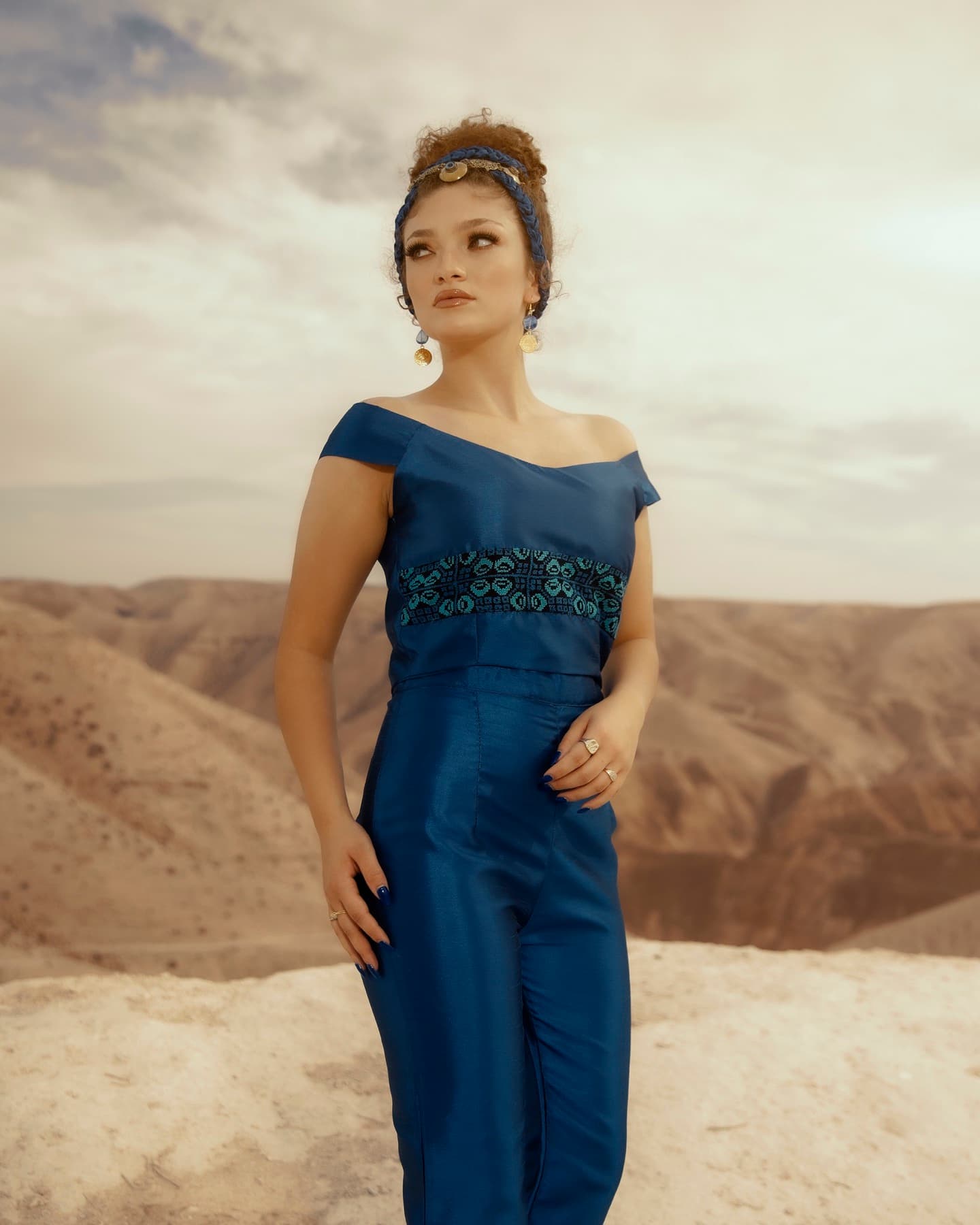 Cobalt motif portrait against desert