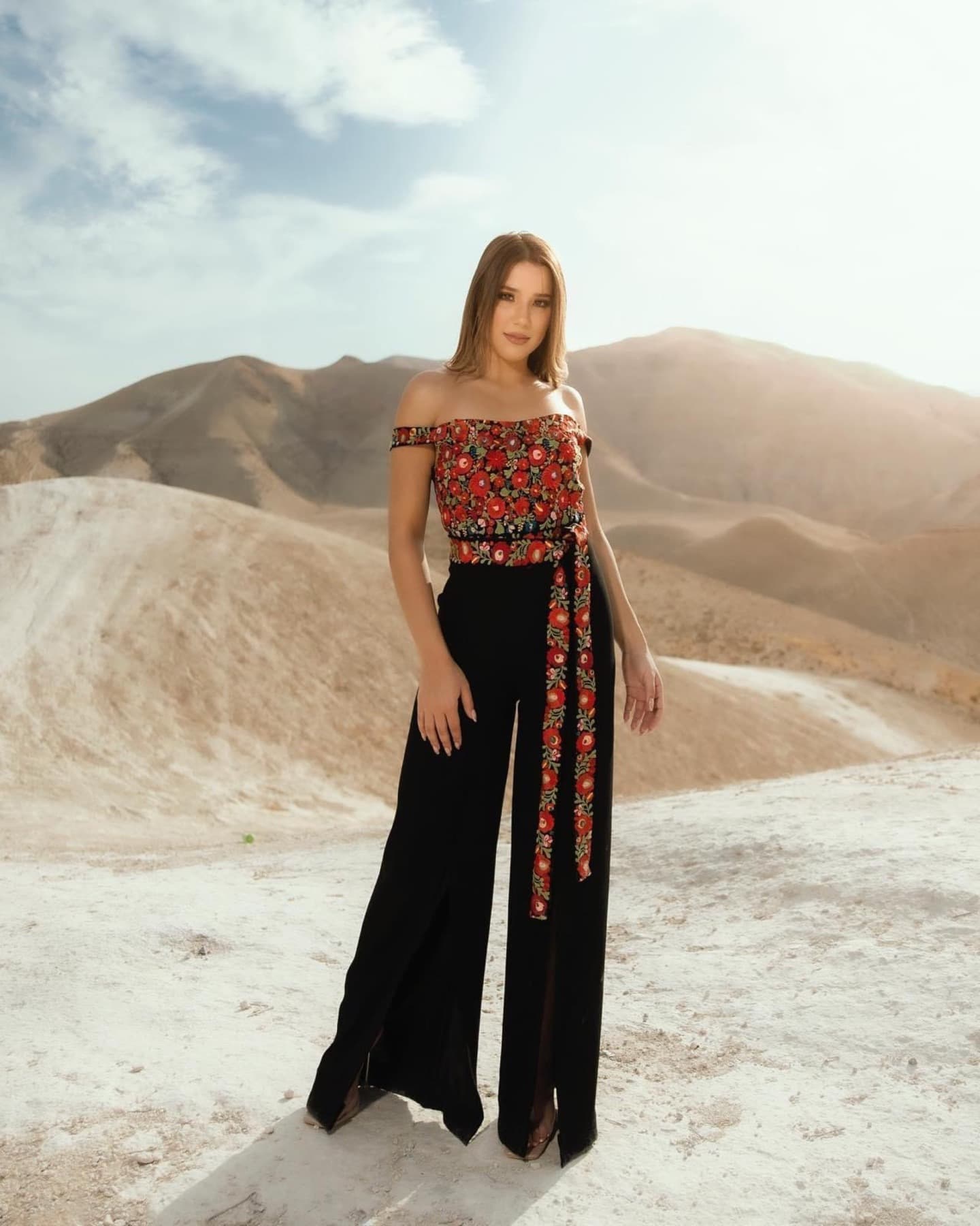 Palestinian Motifs floral garment in desert landscape