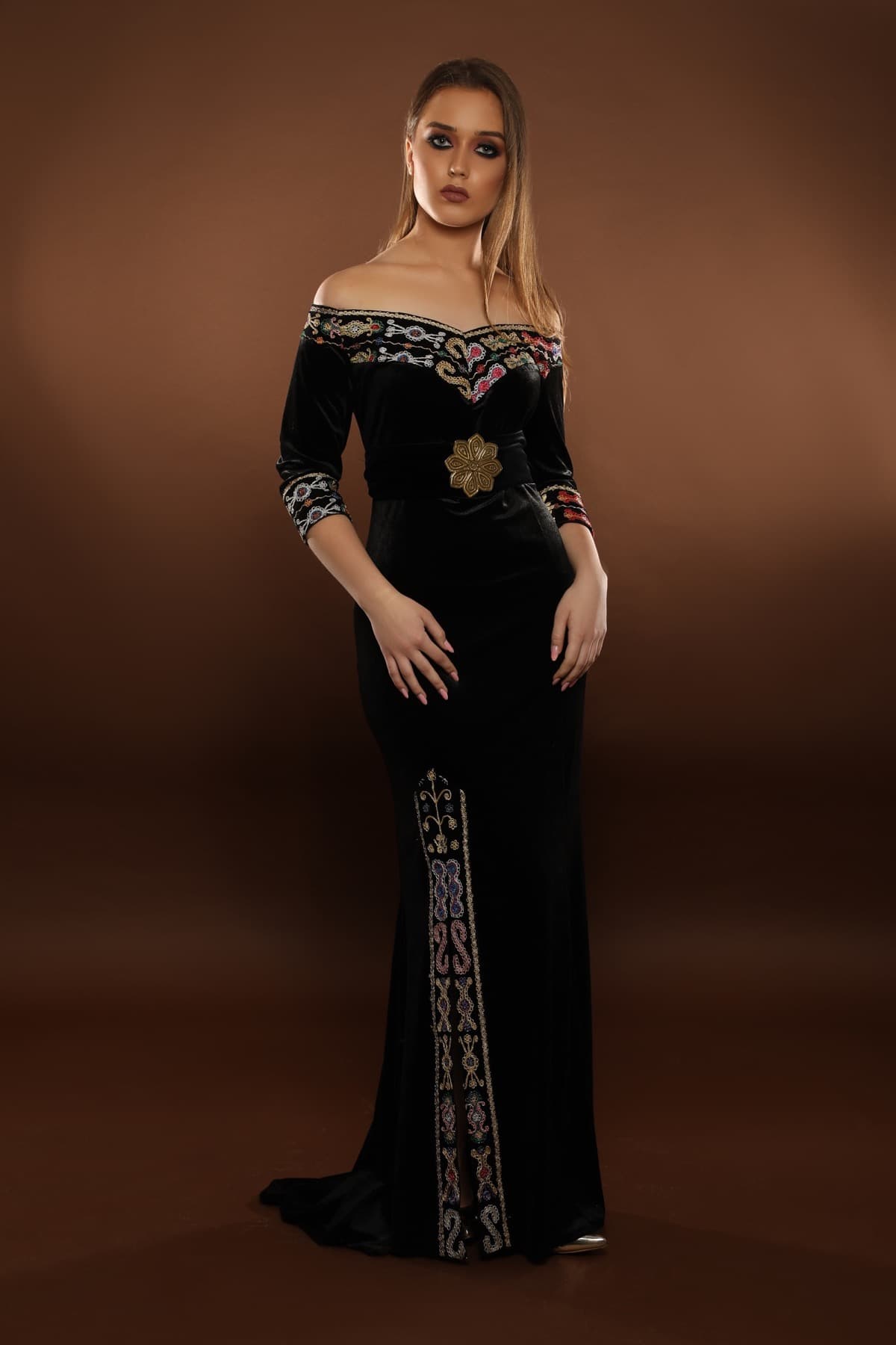 Black velvet Queen of Canaan gown with embroidered neckline