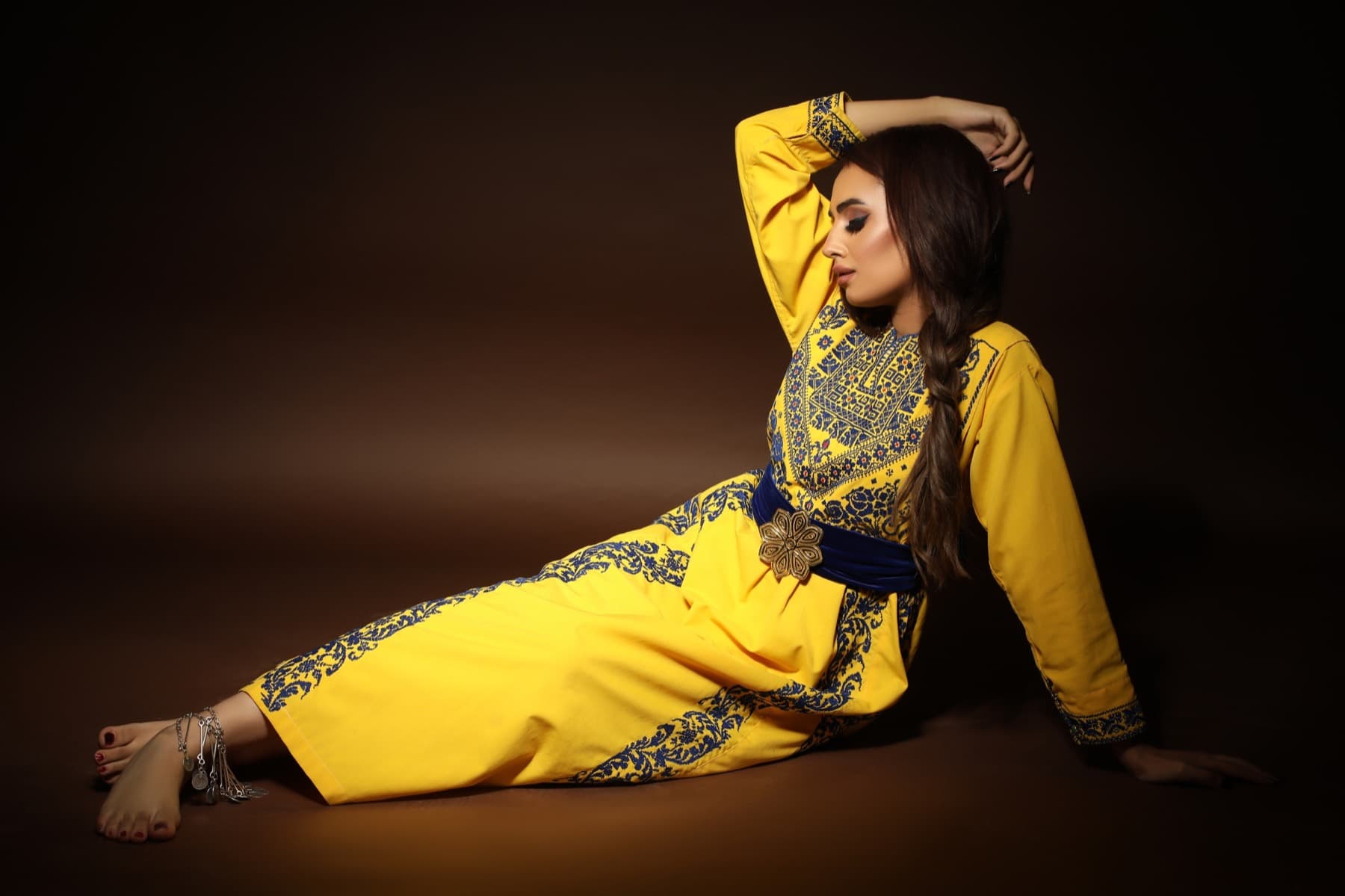 Yellow embroidered Queen of Canaan dress reclined